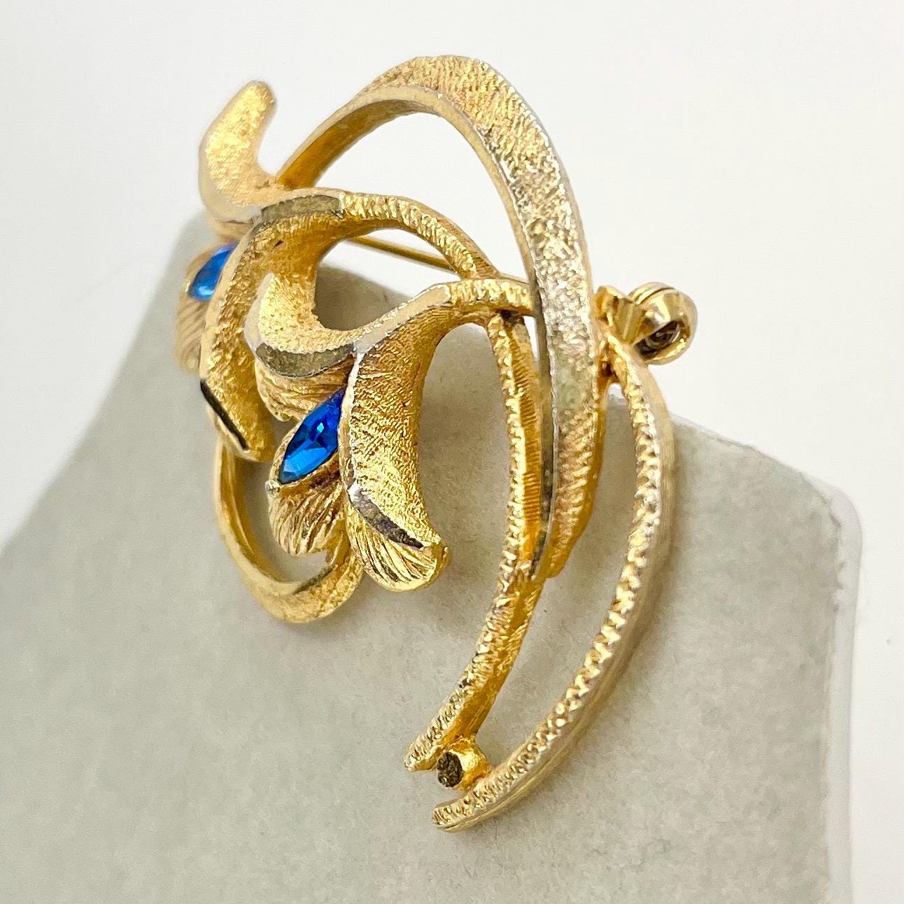 Vintage Gold Tone Floral Brutalist Style Brooch with Blue Marquise Cut Crystal Accents Contempory Costume Jewellery Statement Piece TheGreenGlassGemShop