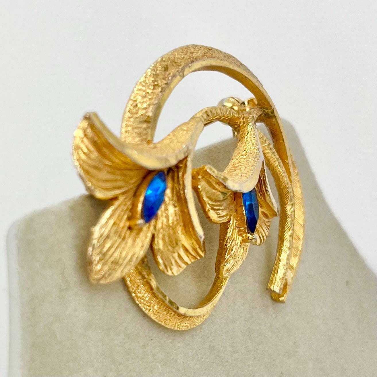 Vintage Gold Tone Floral Brutalist Style Brooch with Blue Marquise Cut Crystal Accents Contempory Costume Jewellery Statement Piece TheGreenGlassGemShop