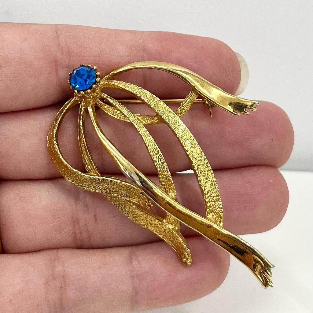 Vintage Hollywood Gold Tone Brutalist Ribbon Brooch with Blue Crystal Accents Contempory Costume Jewellery Statement Piece TheGreenGlassGemShop