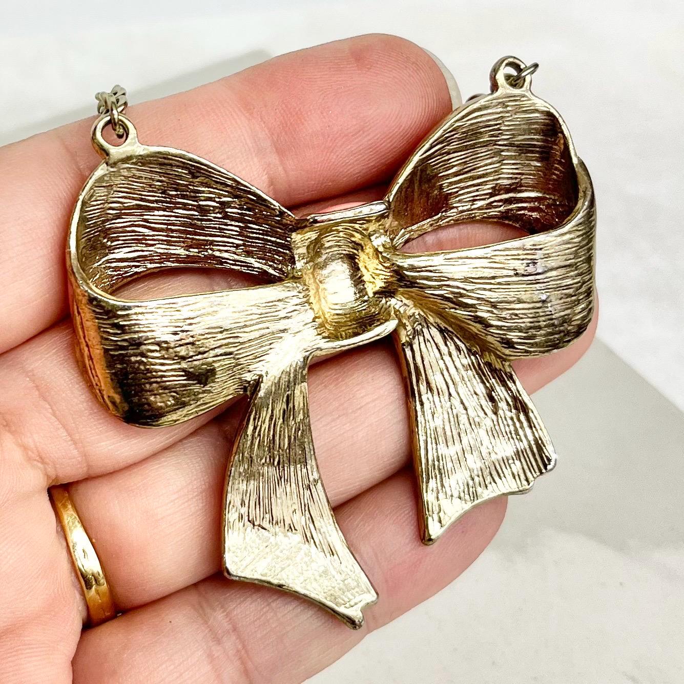 Pink Bow Necklace : Vintage Design of a Large Pink Enamelled Bow Hanging Between a Gold Tone Cutb Chain MillyOliverVintage